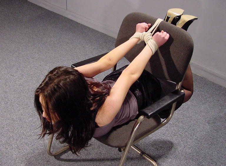 Lady tied chair squirting